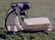 Sandblasting in the field at the back of Cottage Classics