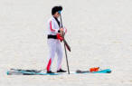 Elvis on a paddle board