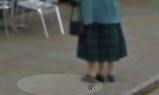 Three legged woman outside The Crown