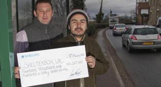 Greg Davis and Juan Romero with a &pound;14,167 cheque for ShelterBox