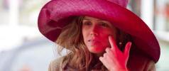 Trying before buying a big red hat on Framlingham market