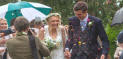 Newly married couple in the rain
