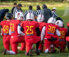 The Birmingham Lions taking a knee for an injured player