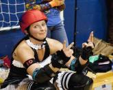 A Red, White abd Bruise skater in the penalty box