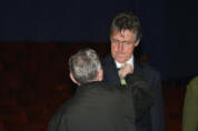 Griff Rhys Jones having a radio mike clipped on